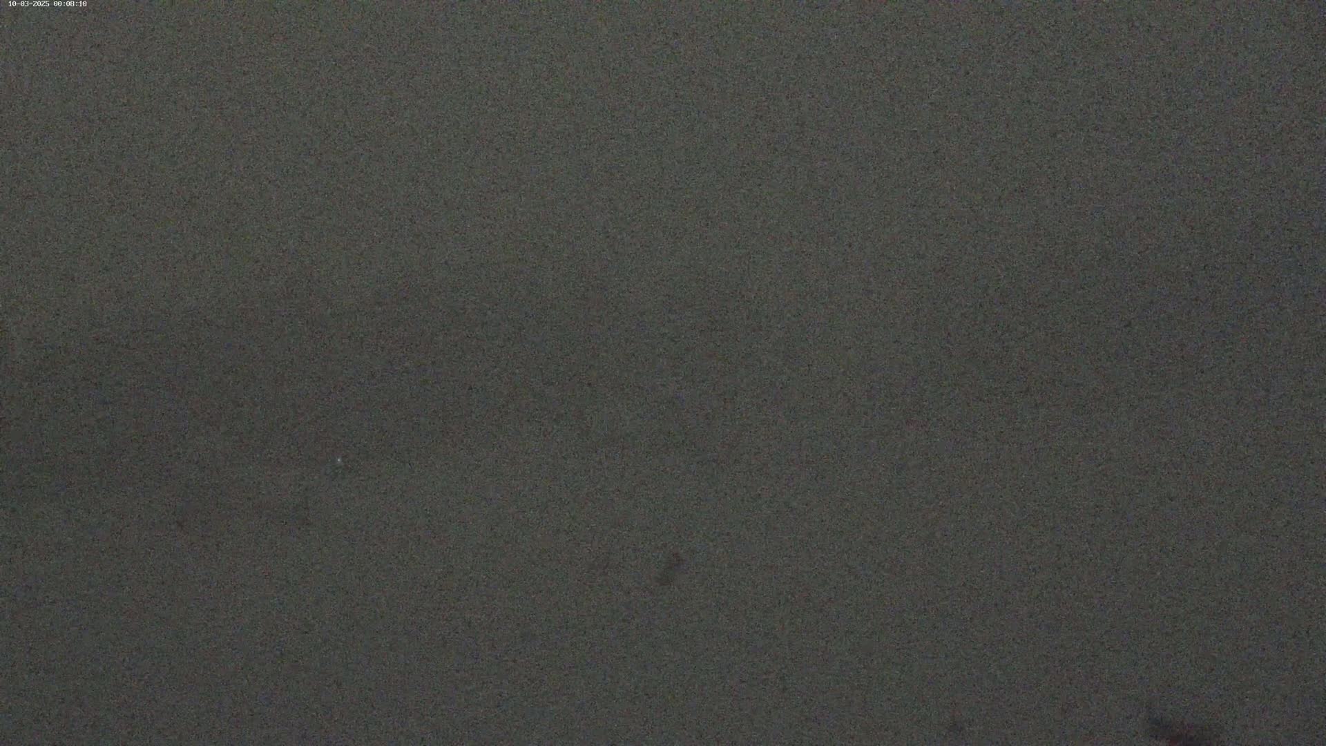 The image shows a dark gray, textured surface.