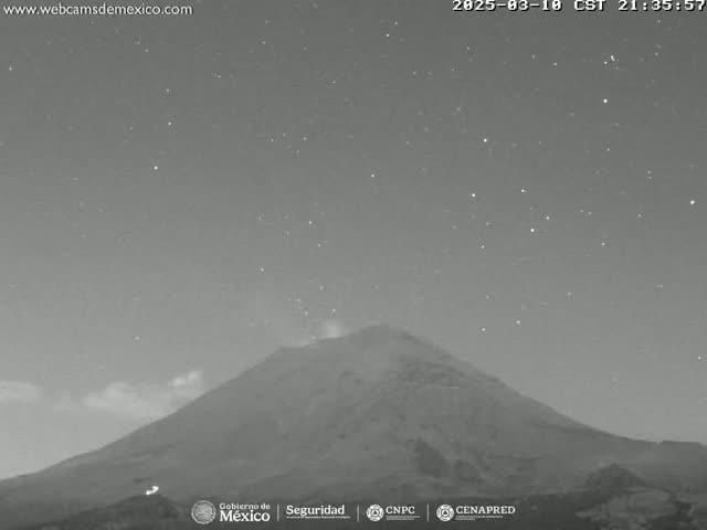 A nighttime, starlit view of a large, dark volcano with a faint plume of smoke or steam emanating from its summit.