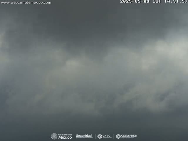 A mostly cloudy sky with dark gray clouds dominating the view.