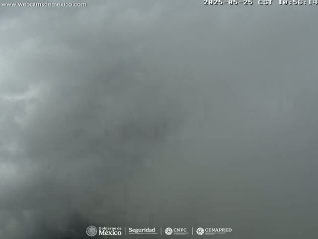 A mostly overcast sky is visible, with a predominantly gray hue and some lighter areas suggesting cloud formations.