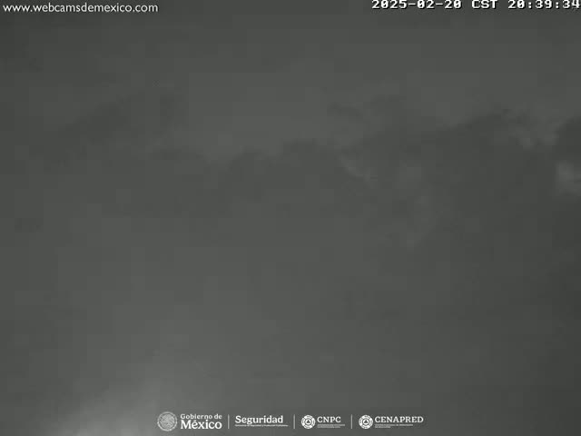 A dark, overcast sky is visible, with a hazy or foggy atmosphere.