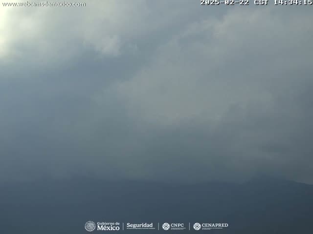 A hazy, overcast sky blankets a distant, indistinct landscape.