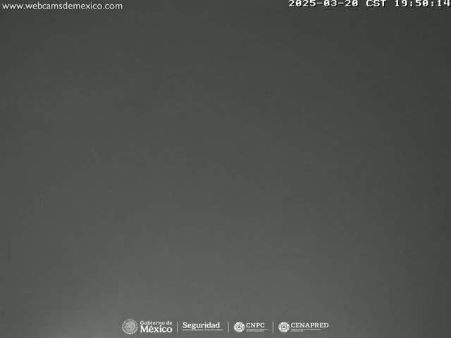 A dark gray, overcast sky is visible.