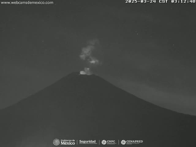 A dark, silhouetted volcano erupts a plume of smoke under a night sky with some visible stars.