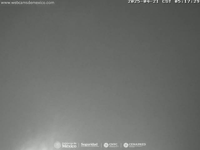 A mostly overcast, gray sky is visible.