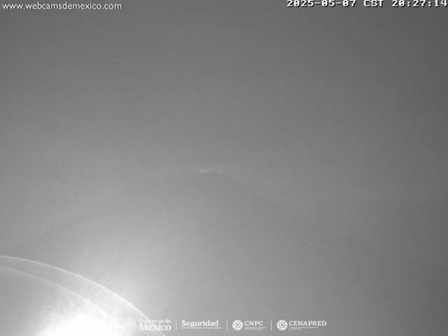 A mostly overcast sky is visible at night.