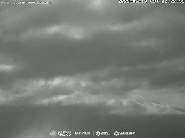 A mostly cloudy sky is visible, appearing overcast with some lighter areas.
