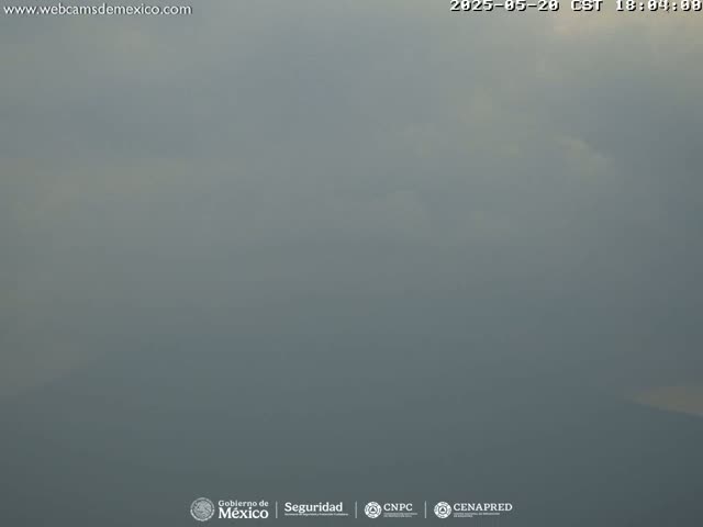 A hazy, overcast sky is visible, obscuring any distant features.