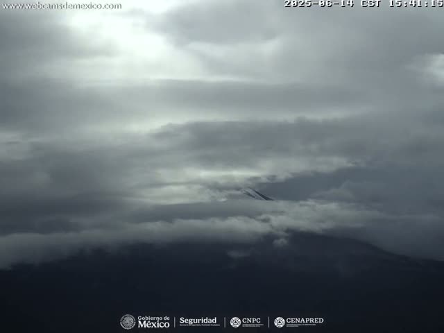 A mostly cloudy sky, with a dark, overcast appearance.