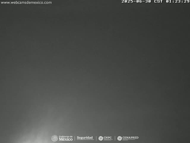 A dark, overcast night sky is visible.
