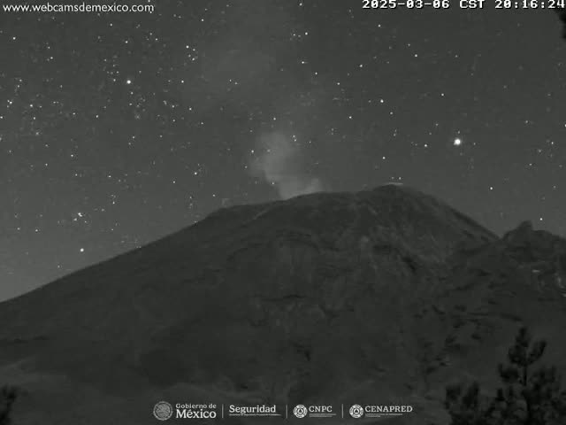A dark, mountainous volcano is seen under a clear, starry night sky, with a faint plume of smoke emanating from its peak.