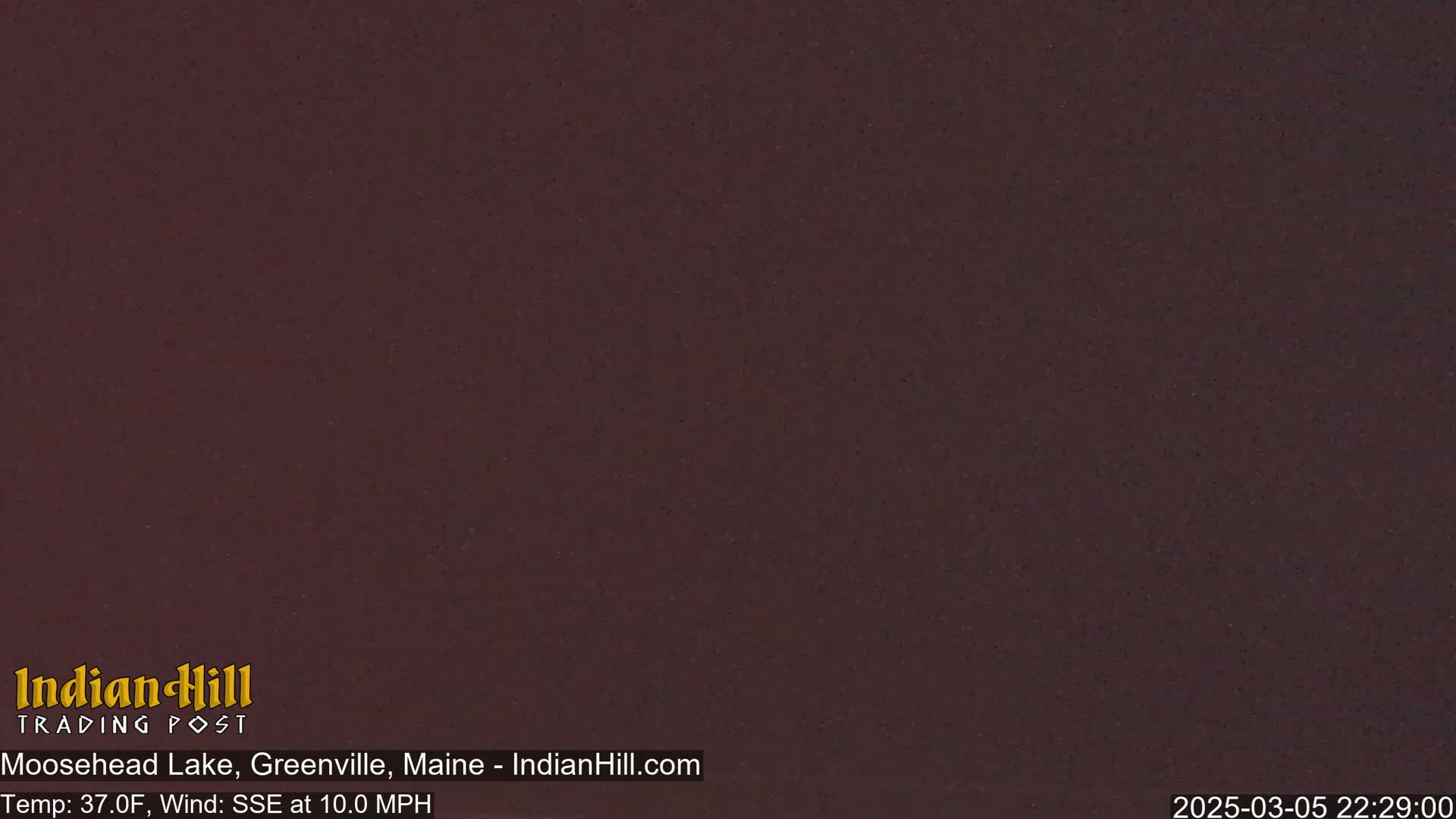 A dark, uniformly colored image shows a night scene with a temperature of 37 degrees Fahrenheit and a wind blowing from the southeast at 10 miles per hour.