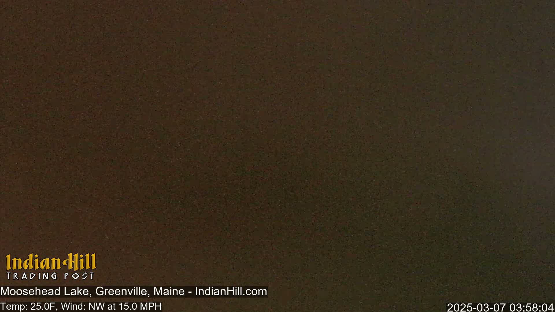 A dark, uniformly colored image shows a night scene with a temperature of 25 degrees Fahrenheit and a northwest wind of 15 miles per hour.