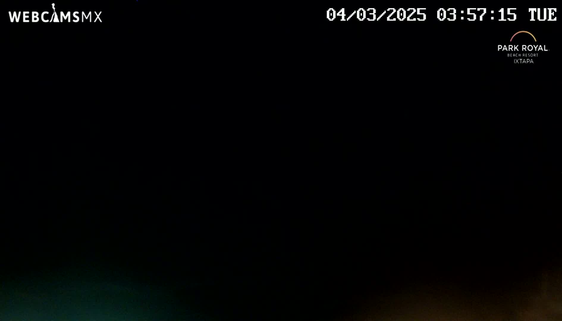 The image shows an almost entirely black screen with a very dark, possibly nighttime, scene at the bottom.