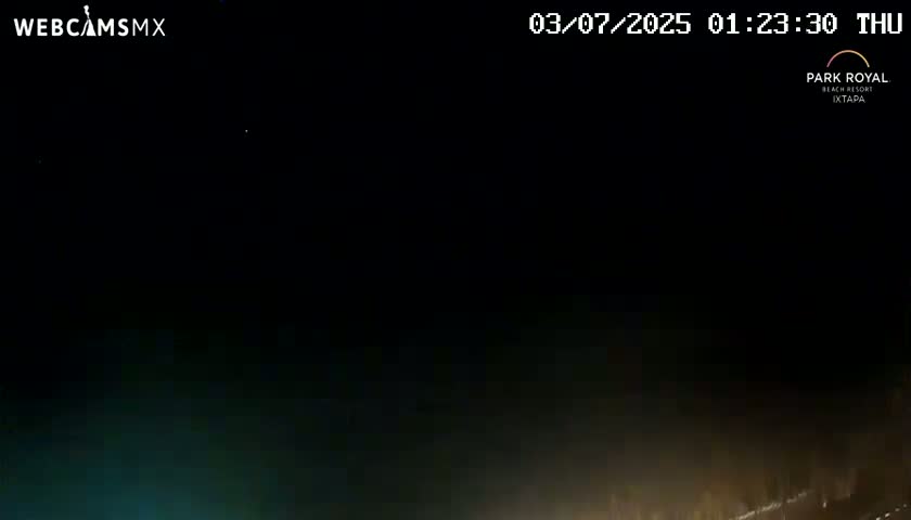 A nighttime, dark scene shows a dimly lit area at the bottom of the frame.