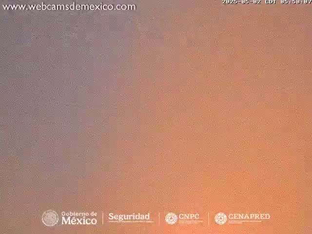 A hazy, orange and gray sky is visible outdoors.