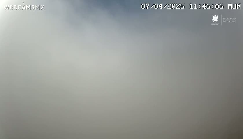 A hazy, overcast sky is visible.