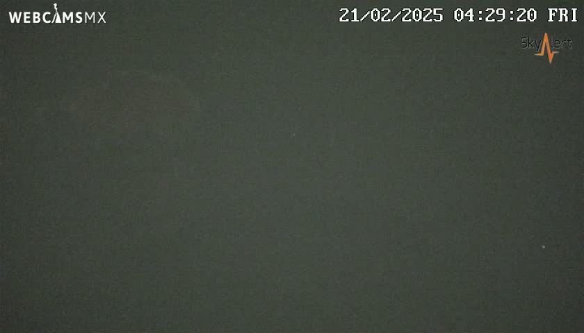 A dark, uniformly colored image shows a completely overcast night sky.
