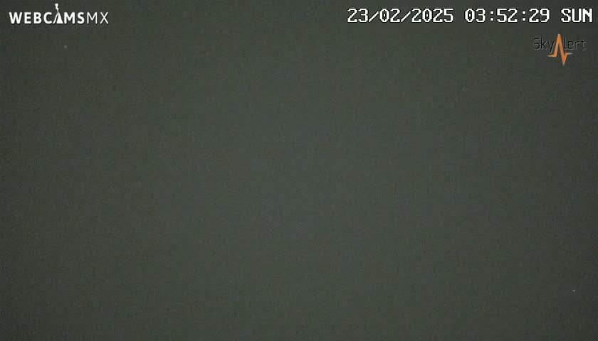 A dark gray, overcast sky is visible.