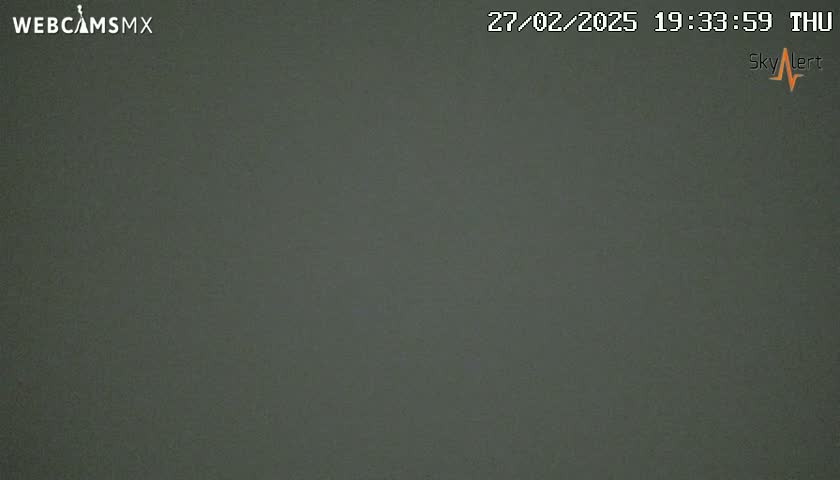 A uniformly dark gray surface is shown.