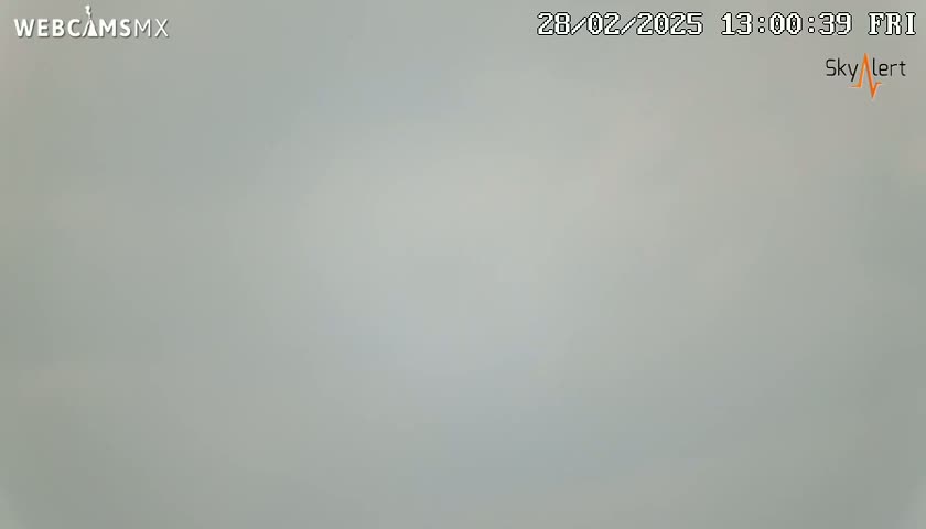 A mostly overcast sky is visible.