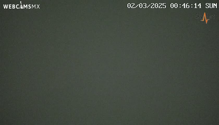A dark gray, uniformly colored image shows a completely overcast night sky.