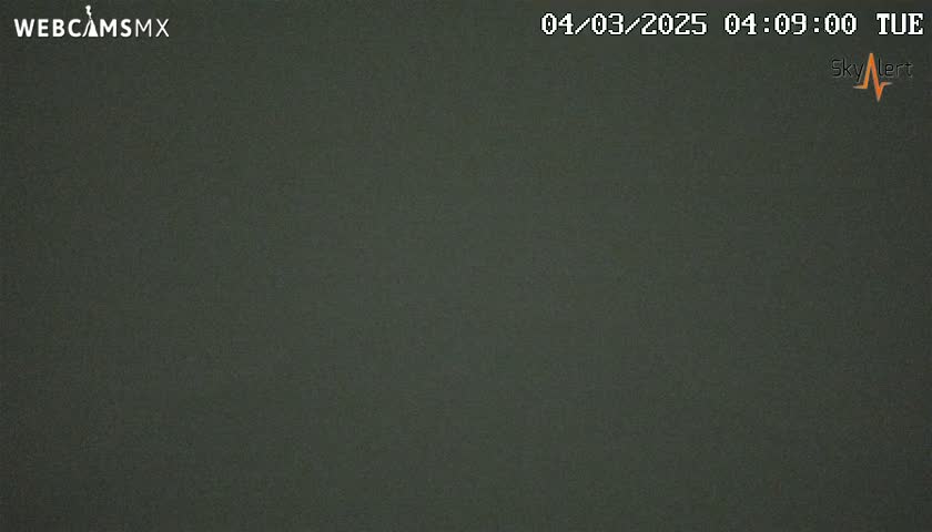 A dark, uniformly colored image shows an overcast sky.