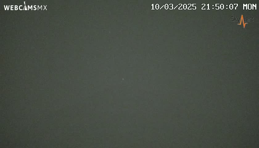 A dark, overcast night sky is visible.
