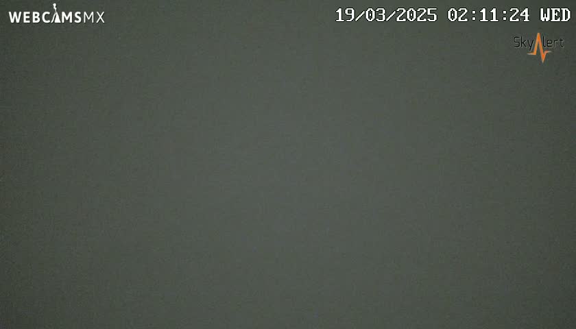 A uniformly dark gray image shows an overcast sky.