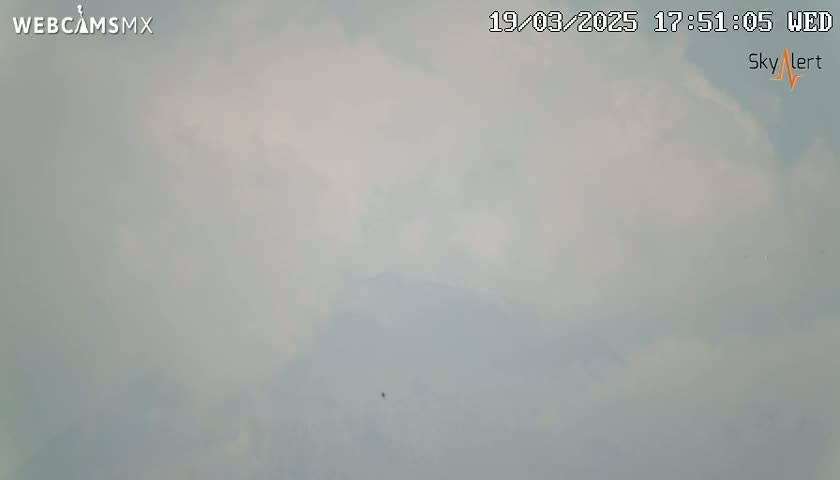 A hazy, overcast sky is visible.