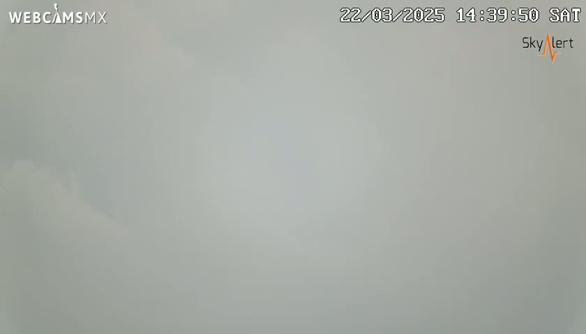 A mostly overcast sky is visible.