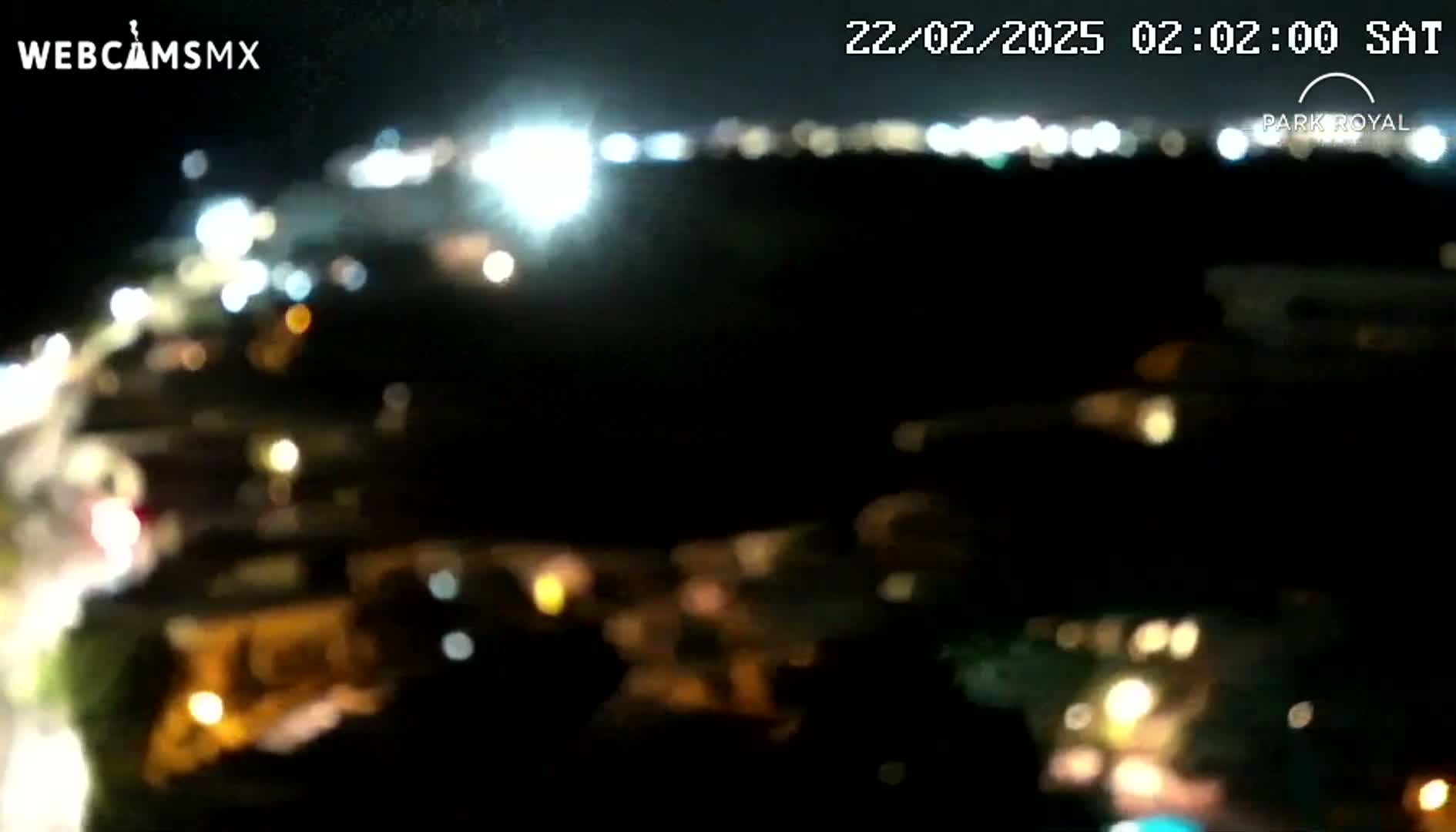 A blurry nighttime view of a city landscape with numerous out-of-focus lights.