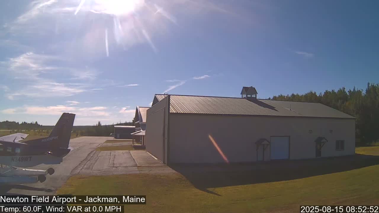A bright light flares in the center of a dark, nighttime scene with a hint of structure to the right, under a calm, 71°F night with a 6 mph north-northwest wind.