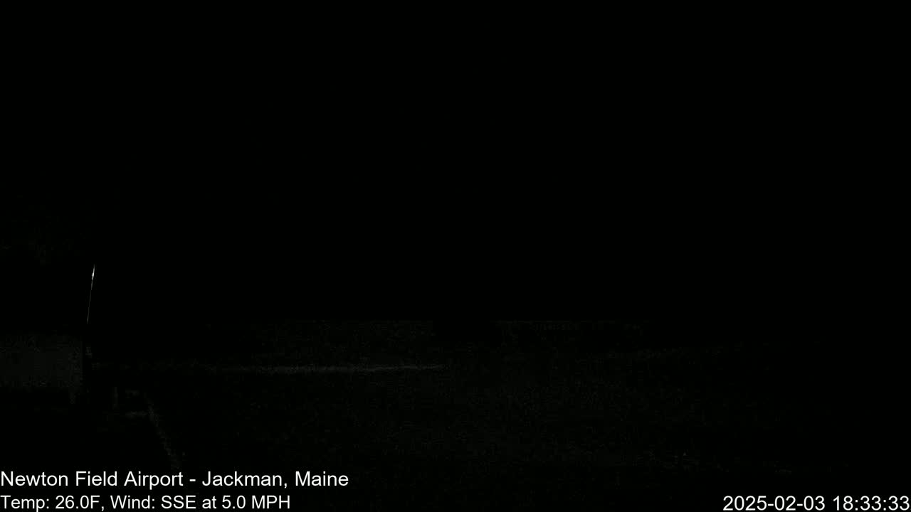 A dark, nighttime scene shows a mostly black landscape with a faint horizontal line near the bottom, under a clear, dark sky, with a 26°F temperature and a 5.0 mph SSE wind.