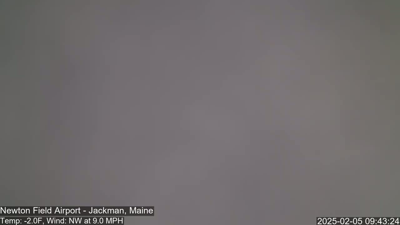 A uniformly gray, overcast sky is visible outdoors, with a northwest wind at 9 mph and a temperature of -2°F.