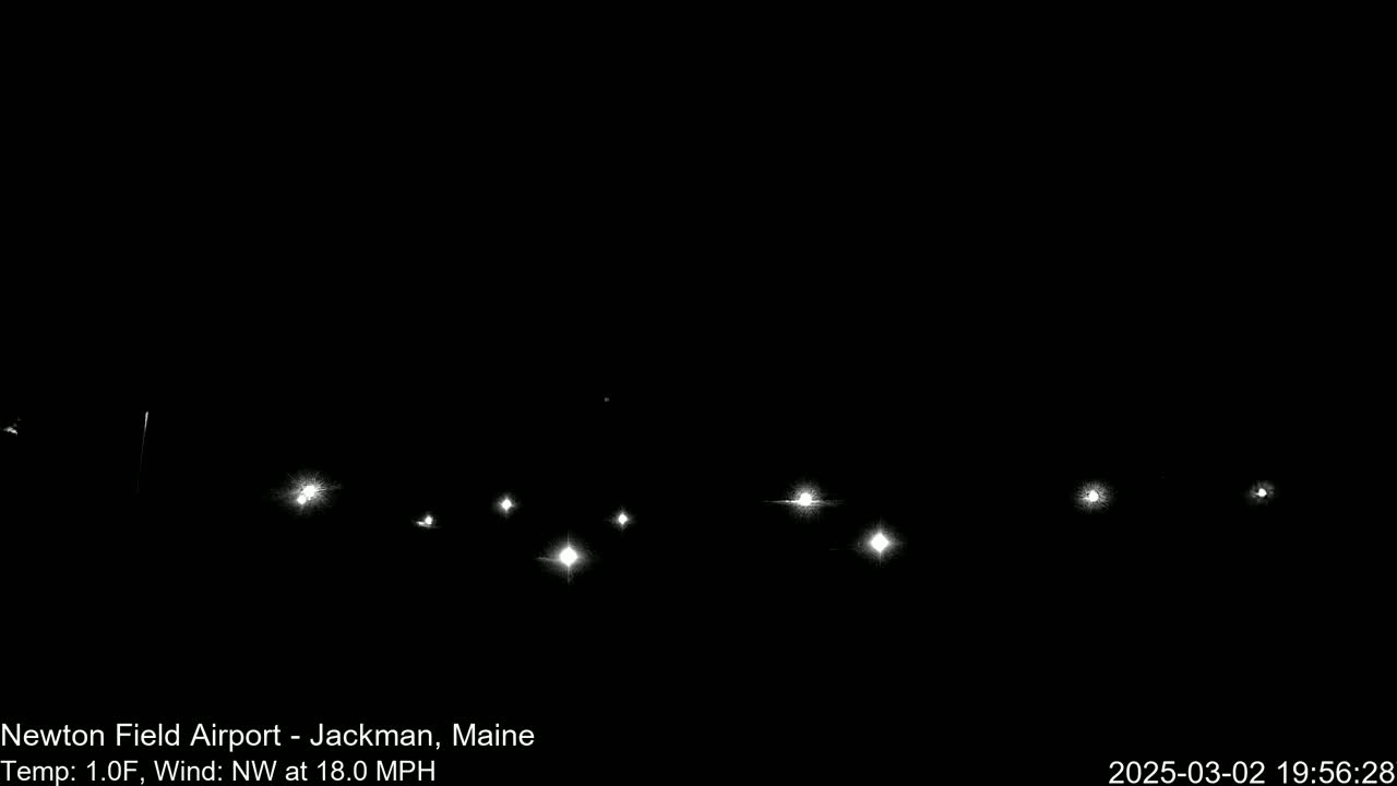 Several bright lights are visible in the dark night, with a northwest wind blowing at 18 mph and a temperature of 1 degree Fahrenheit.
