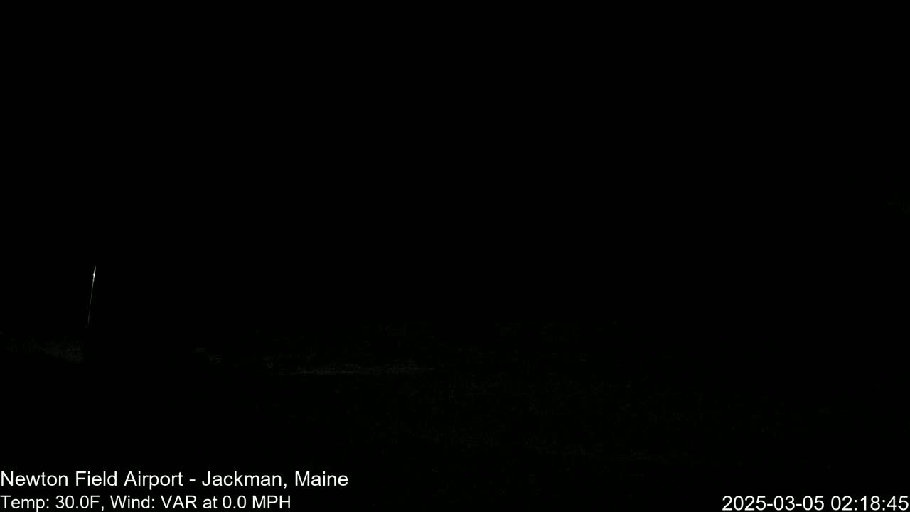 A dark, nighttime scene shows a dimly lit area with a 30°F temperature and no wind.