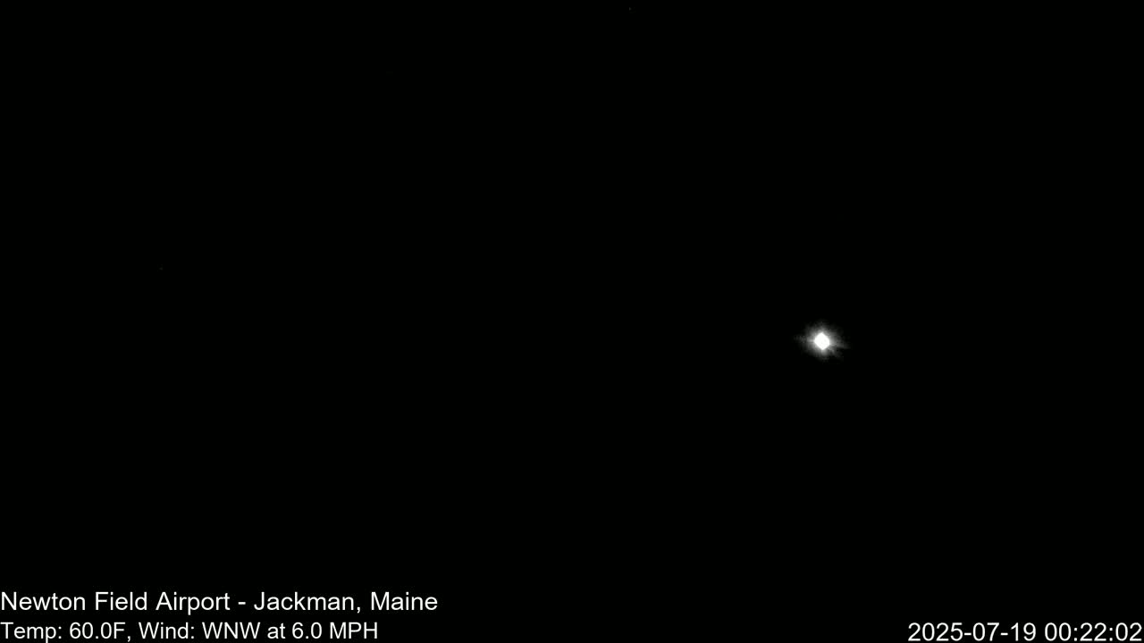 A bright light, possibly the moon, is visible in a dark night sky with a 60°F temperature and a 6.0 mph wind from the west-northwest.