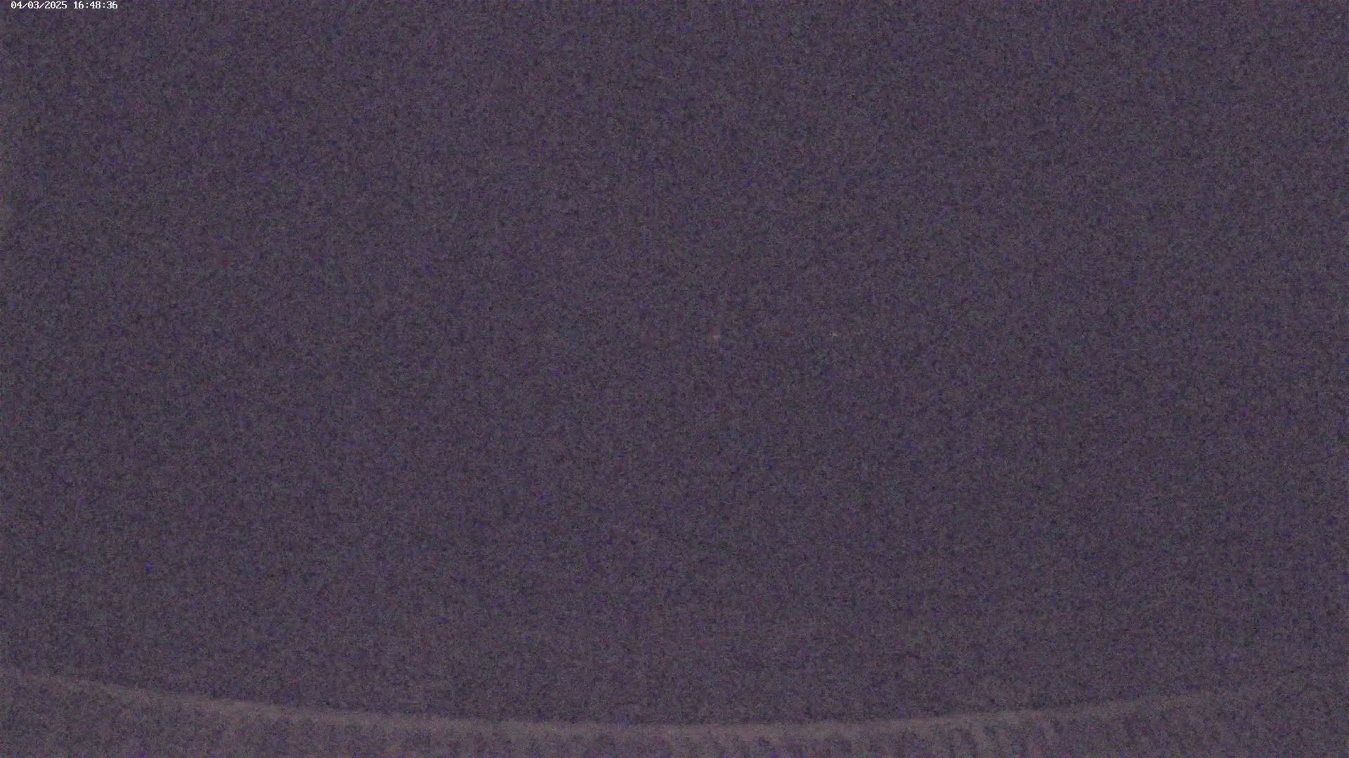 A dark, possibly nighttime, sky is shown.