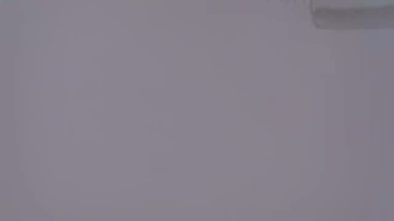 The image shows a plain, light gray surface.