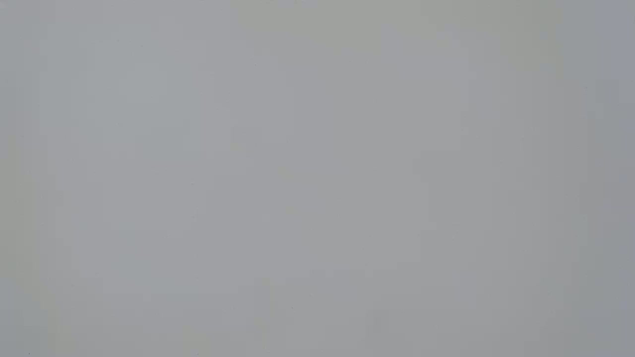 The image shows a plain, light gray surface.