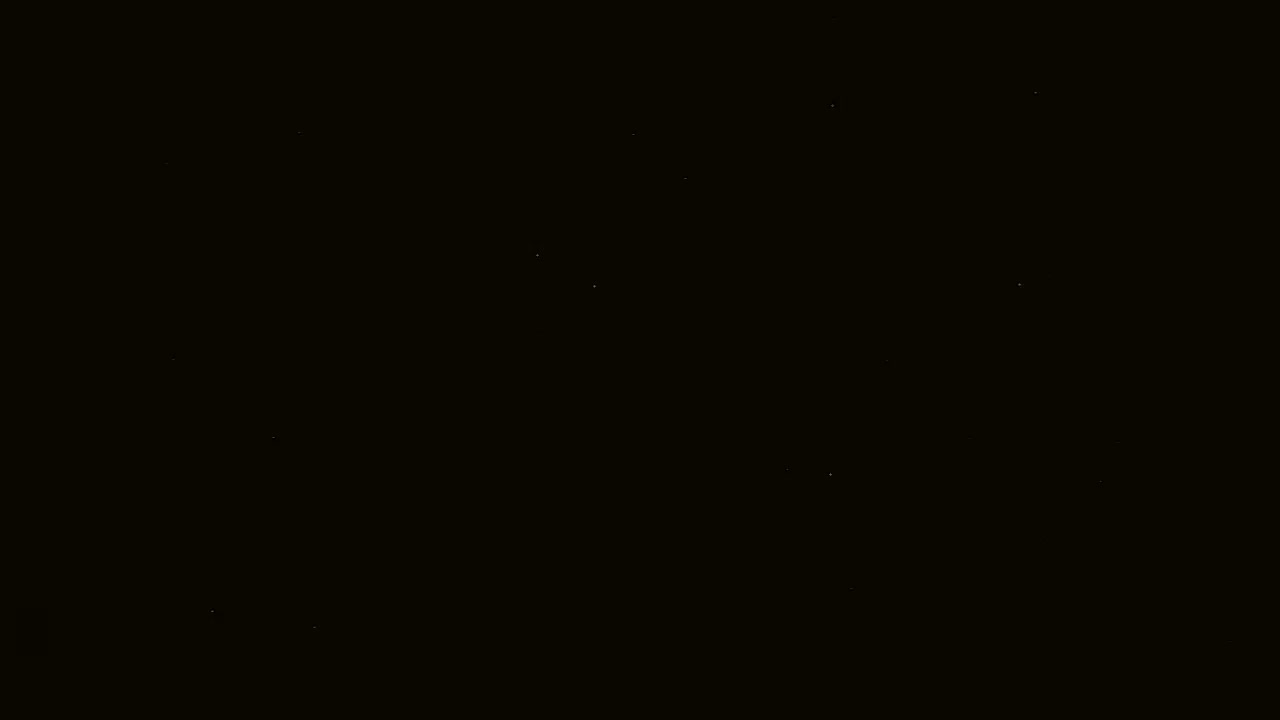 A black background speckled with faint, tiny points of light.