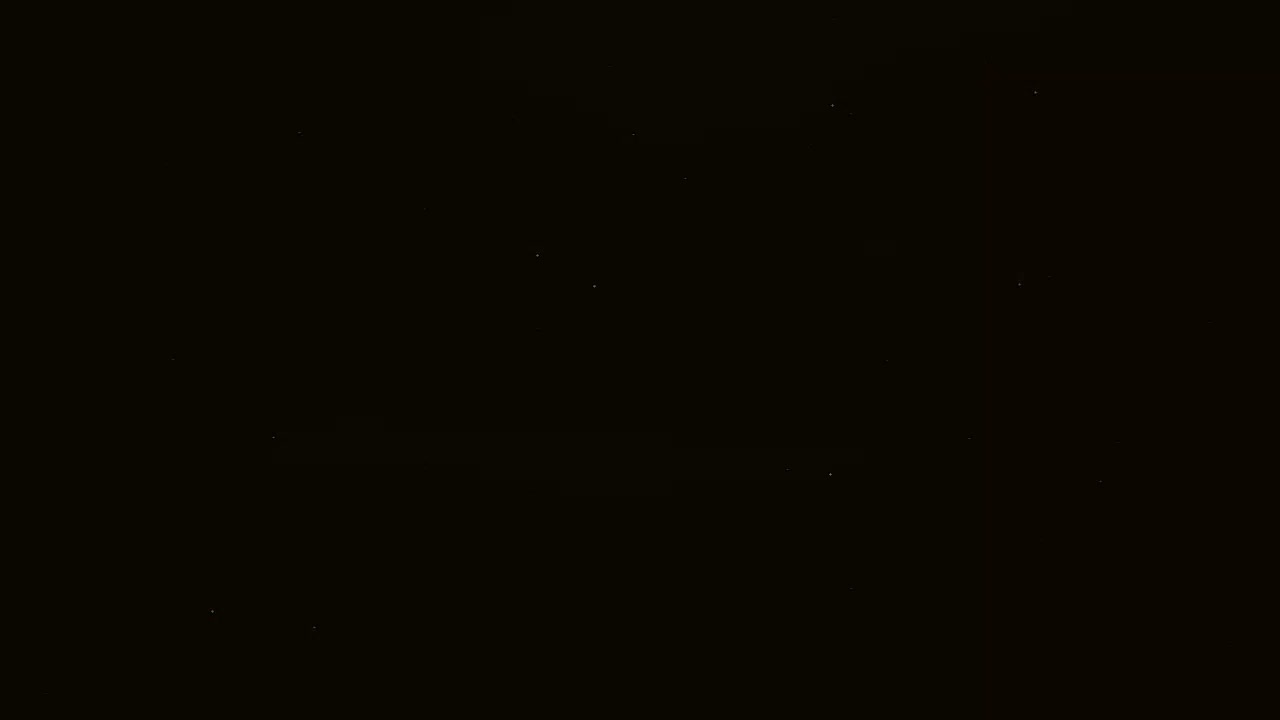 A nighttime sky speckled with a few faint stars.