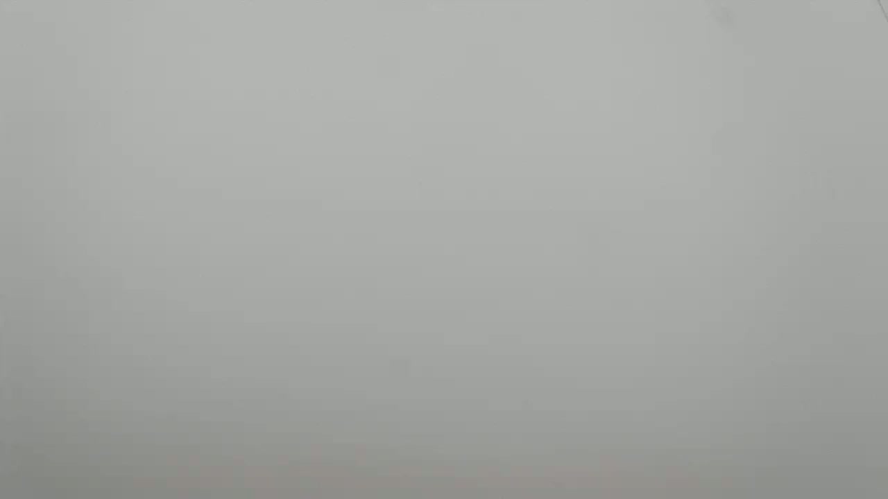 The image shows a solid, light-grey background.
