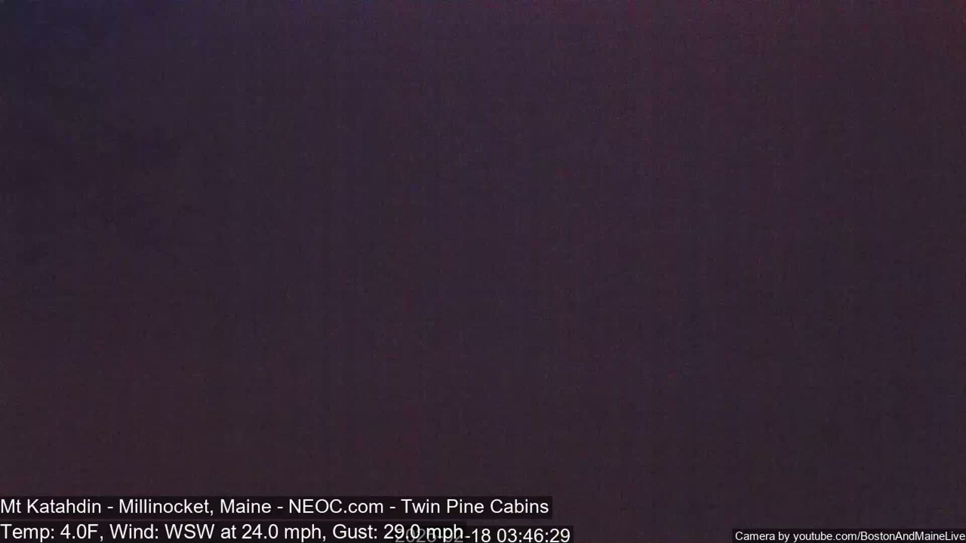 A dark, nighttime outdoor scene with a temperature of 4°F and a wind blowing from the west-southwest at 24 mph, gusting to 29 mph.