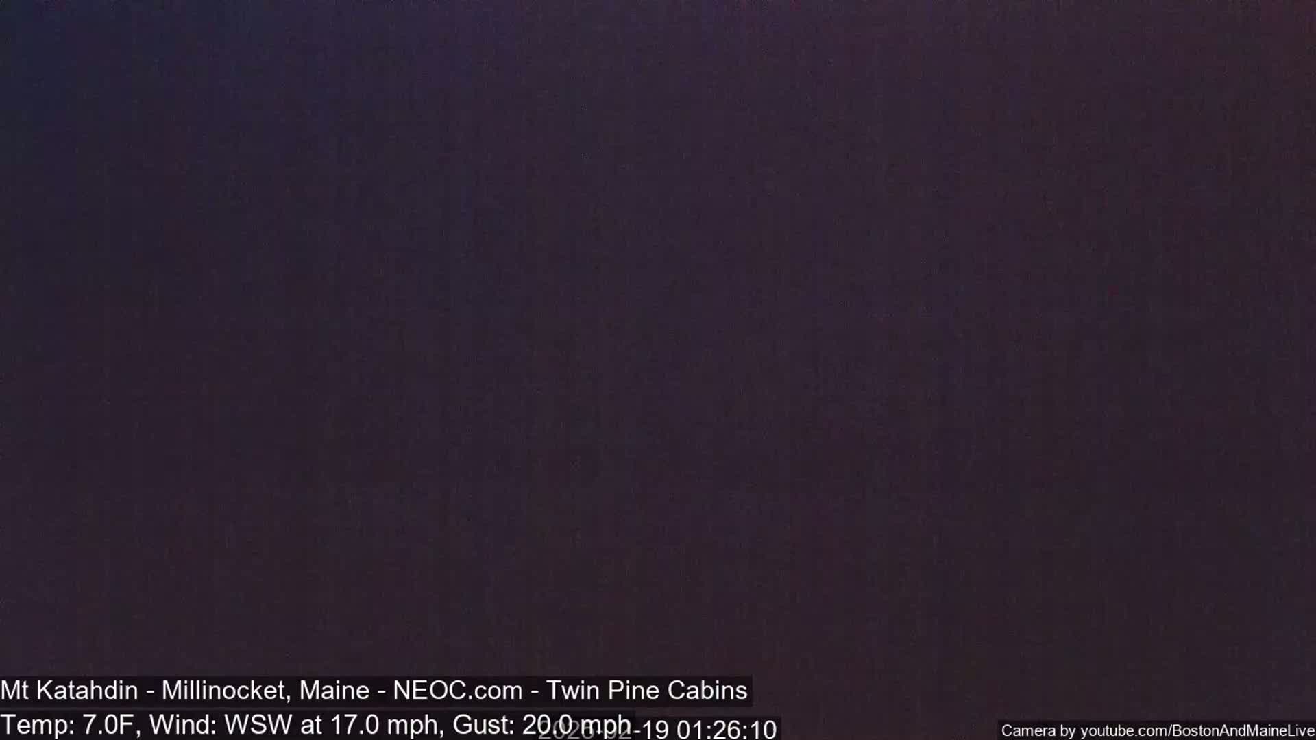 A dark, nighttime scene with a temperature of 7°F and a wind blowing from the west-southwest at 17 mph, gusting to 20 mph.