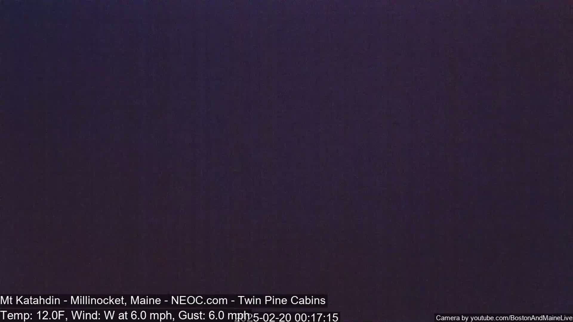 A dark purple-gray screen shows a nighttime view with a temperature of 12 degrees Fahrenheit and a westerly wind of 6 miles per hour.