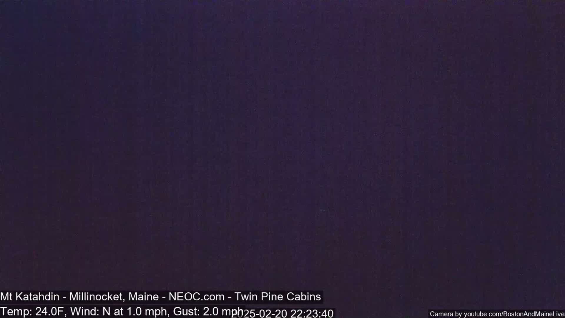 A dark, nighttime scene with a temperature of 24 degrees Fahrenheit and a light northerly wind.