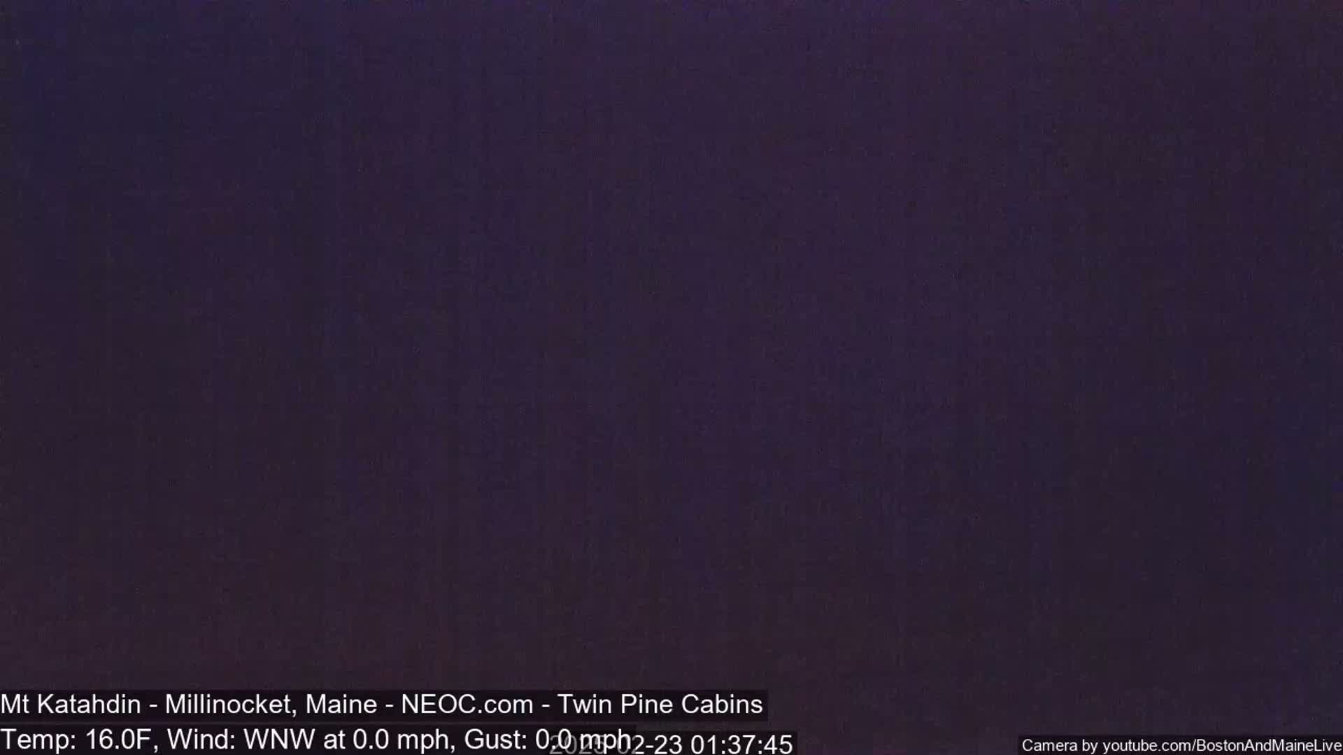 A dark, nighttime outdoor scene shows a completely dark sky with a temperature of 16 degrees Fahrenheit and a calm wind.