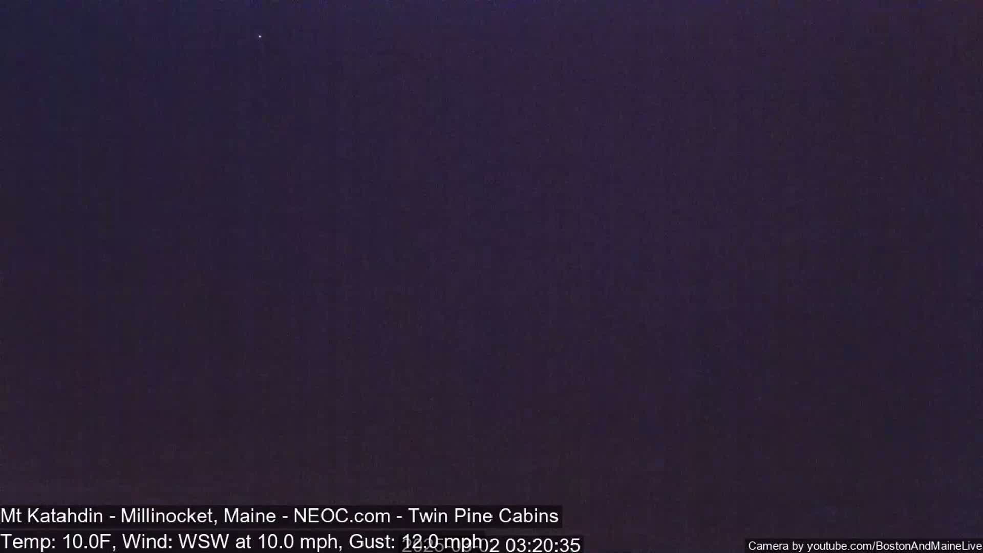 A dark, nighttime scene with a clear, starlit sky.